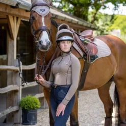 My LeMieux Base Layer Mink -Fournitures Équestres Boutique LeMieux Base Layer mink on rider standing with horse 5915 2b9e6460 8559 4869 8812 cbee4c3fd9c7